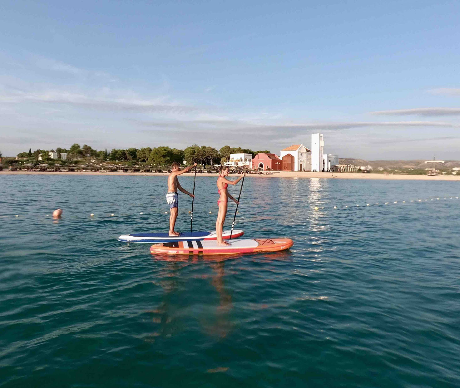 Couple-water-sports-activities-SUP-scaled